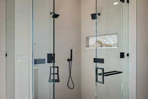 Full bathroom featuring a stall shower