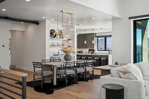 Dining area featuring light wood-style flooring and recessed lighting