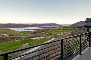 Mountain view featuring a nearby body of water