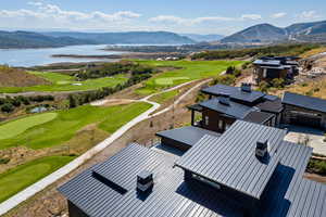 Bird's eye view of a golf club and a water and mountain view