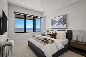Carpeted bedroom featuring baseboards and recessed lighting