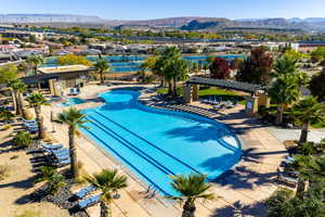 Community pool featuring a patio area, a mountain view, and a pergola