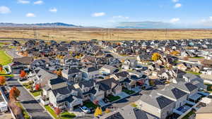 Aerial view of residential area with a mountain backdrop