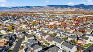 Aerial view of residential area featuring a mountain backdrop
