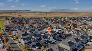 Aerial view of residential area with a mountainous background