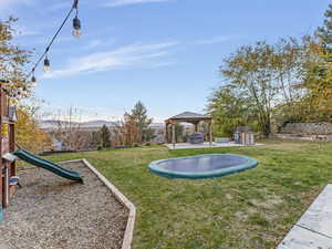 Play area with in ground tramp