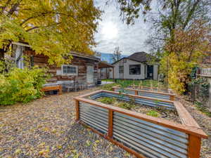 Back of house featuring a garden and a patio area