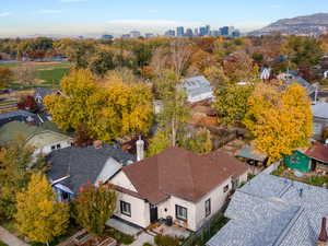 Aerial perspective of suburban area featuring skyline and a mountainous background