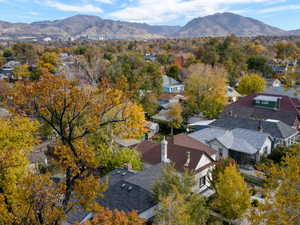 Aerial perspective of suburban area featuring a mountainous background