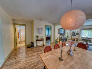 Dining room with wood finished floors and baseboards