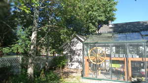 View of outbuilding with a sunroom