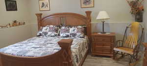 Bedroom with wood finished floors