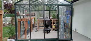 View of greenhouse with a sunroom
