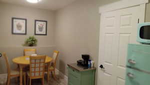 Dining room featuring baseboards and wood finished floors