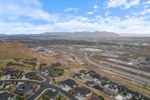 Aerial overview of property's location with nearby suburban area and mountains