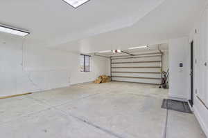 Garage featuring a garage door opener