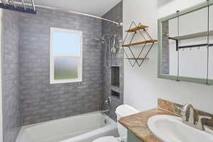 Full bathroom featuring vanity and bathing tub / shower combination