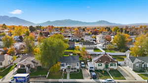 Aerial perspective of suburban area featuring a mountainous background