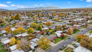 Aerial view of residential area featuring a mountain backdrop