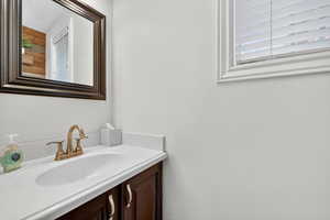 Bathroom featuring plenty of natural light and vanity