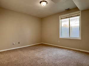 Bedroom with carpet flooring and baseboards