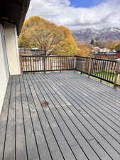 Wooden deck featuring a mountain view