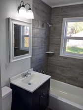 Bathroom featuring bathing tub / shower combination and vanity