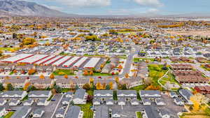 Aerial perspective of suburban area with a mountainous background