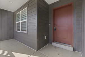 Entrance to property with board and batten siding