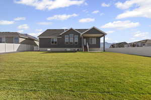 Back of house featuring a fenced backyard, stucco siding, a patio area, and a residential view