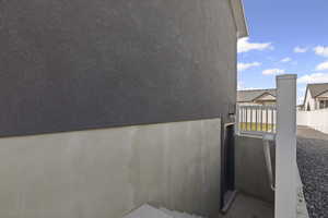 View of side of home with stucco siding