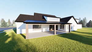 Back of house with a standing seam roof, a metal roof, a yard, and a patio