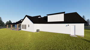 Back of property with a lawn