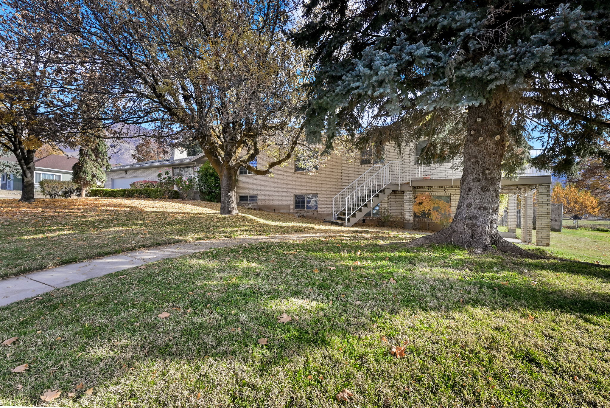 View of green lawn featuring stairs