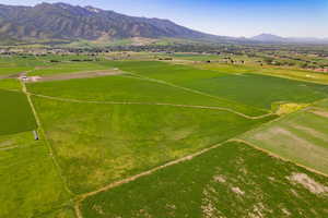 Aerial view of sparsely populated area with a mountain backdrop