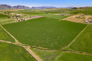 Overview of rural landscape with a mountain backdrop
