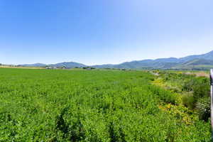 View of mountain backdrop with rural landscape