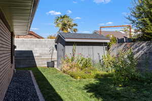 Fenced backyard with a shed