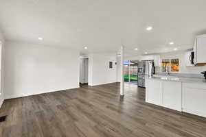 Unfurnished living room with recessed lighting and light wood-style floors