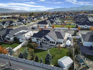 Aerial perspective of suburban area with a mountain backdrop