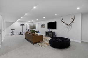 Living room featuring light carpet and recessed lighting
