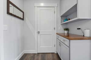 Entryway featuring wood finished floors and baseboards