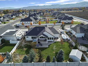 Aerial view of residential area featuring a mountainous background
