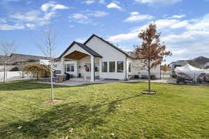 Back of house with a patio