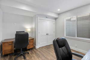 Office space featuring dark wood-style flooring and recessed lighting