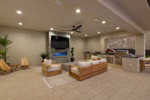 Living room featuring recessed lighting, ceiling fan, and a stone fireplace
