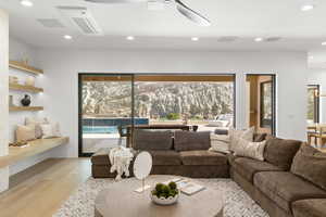 Living area featuring recessed lighting, light wood-type flooring, and ceiling fan