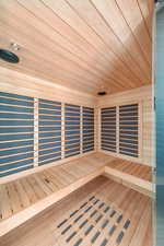 Relaxing sauna / steam room featuring wooden ceiling