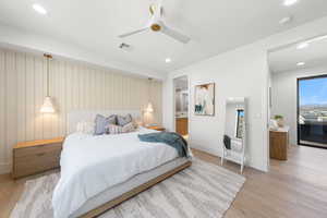 Bedroom featuring wood finished floors, recessed lighting, a ceiling fan, and ensuite bathroom