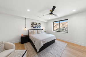 Bedroom featuring light wood-style flooring, recessed lighting, and ceiling fan